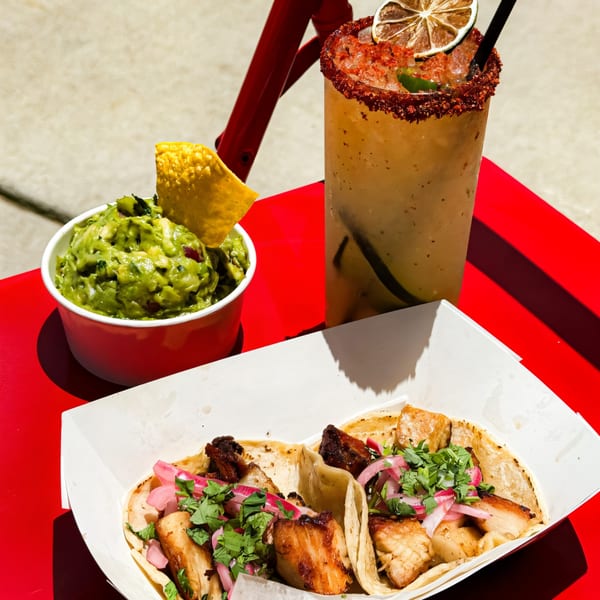 Chido Taco's guacamole, tacos with pork belly, pickled onions, cilantro, and a chili-rimmed margarita.